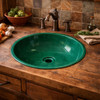 Round talavera bathroom sink solid green gloss design in a rustic kitchen with wood accents