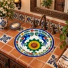 Round talavera bathroom sink bird floral design Mexico displayed in a Spanish Revival bathroom