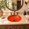 Round talavera bathroom sink terracotta floral design in a Mediterranean vanity with natural light
