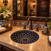 Round talavera bathroom sink blue mandala design Mexico featured in a restaurant bathroom with ambient lighting and elegant finishes