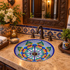 Round talavera bathroom sink blue floral design Mexico placed in a hacienda bathroom with stone walls and warm textures
