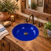 Round talavera bathroom sink solid cobalt blue design in a rustic wood vanity
