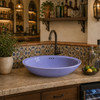 Double sided hand painted oOval bathroom sink blue installed in an elegant kitchen bar setting