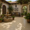 Washed baggie Mexican talavera tiles enhancing a Spanish courtyard with stucco and stone details