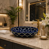 Double sided hand painted oval bathroom sink petals in luxury bathroom with artisan decor