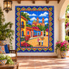 Mexican tile mural colonial town square displayed in a covered courtyard with rustic decor.