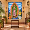 Our lady of Guadalupe tile mural in a Spanish Colonial prayer room with wood and candlelight.