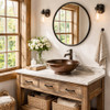 Copper vessel sink with raised base in a rustic farmhouse bathroom with a reclaimed wood vanity cabinet