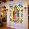 Virgin Guadalupe cactus talavera tile mural design in Spanish Revival interior with arches and terracotta finishes
