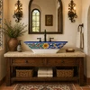 Koi fish talavera vessel rectangular sink above countertop in a Spanish Revival space with rustic textures and iron accents