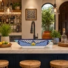 Blue floral talavera vessel rectangular sink above countertop in a kitchen bar adding vibrant artisan detail