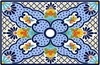 Blue floral talavera vessel rectangular sink above countertop