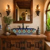Talavera vessel rectangular sink above countertop Mexican bathroom in hacienda interior with rustic decor and natural light