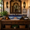 Talavera vessel rectangular sink above countertop artisan style in Spanish Revival house with iron fixtures and plaster walls