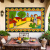 Mexican talavera tile mural colonial village displayed in a Spanish Revival house with traditional architecture