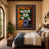 Talavera tile mural with calla lilies in a Mediterranean bedroom with rustic wood and soft linens.