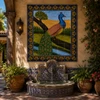 Mexican tile mural - peacock design beside a fountain with patterned tiles and potted palms.