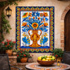 Talavera birds and floral vase mural displayed in Spanish courtyard accent wall with rustic stucco