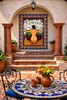Calla lilies figurative talavera tile mural integrated into Spanish Revival architecture with traditional ceramic detail