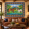 Volcano horses Mexican tile mural displayed in a rustic ranch living room with warm wood accents.