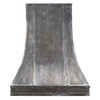 Front view of a dark zinc range hood with riveted vertical strap seams and a tall architectural bell silhouette, tailored and intentionally constructed