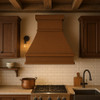 Made-to-order copper range hood in a rustic style kitchen