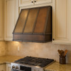 Under-cabinet hammered copper range hood 36-inch in a transitional style kitchen