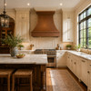 Wall-mount hammered copper bell range hood in a bright traditional kitchen with paneled cabinetry