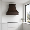 Contemporary minimalist kitchen with dark coffee patina copper range hood flat white cabinets side window