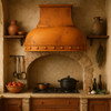 Dome shape copper range hood in Venetian style kitchen, rounded hammered canopy with warm patina above range and ornate classic details
