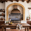 Dome bell copper hood with forged iron straps and pyramid rivets in Spanish Colonial hacienda kitchen