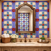 Talavera relief maltese cross handcrafted ceramic tile enhancing a bathroom wall with sculpted detail