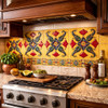 Talavera relief tile floral scroll medallion design installed in a kitchen backsplash with defined relief and solid color finish
