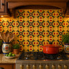 Talavera relief tile floral scroll medallion design installed in a kitchen backsplash with defined relief and solid color finish