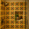 Talavera relief tile floral scroll medallion design featured in a shower wall with strong relief and clearly defined pattern