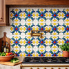 Mexican talavera relief tile floral medallion installed as a decorative kitchen backsplash focal wall