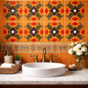 Mexican floral scroll talavera relief tile used on a bathroom vanity wall creating depth warmth and artisanal character