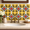 Talavera cross scroll mexican relief tile used on a bathroom vanity wall adding texture warmth and artisanal character