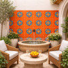 Talavera relief tile floral medallion design applied on a courtyard wall enhancing light and shadow with relief