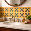 Mexican relief tile bold cross fleur design used on a bathroom vanity wall with solid bold colors