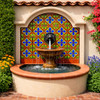 Talavera relief tile blue cross scroll pattern used on courtyard fountain wall with strong depth and solid tones