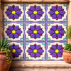 Talavera relief tile purple floral star design featured on courtyard wall with strong relief under natural light