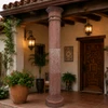 Red stone column with octagonal base for patios on a Spanish Revival porch with terracotta tile