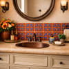 Terracotta blue floral mexican relief tile design accent wall creating warmth and depth in bathroom space