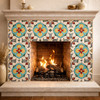 Mexican floral medallion talavera relief tile design featured on an accent wall creating a traditional focal point