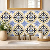 Mexican ornate blue and white floral Talavera relief tile behind bathroom vanity, deep sculpted patterns adding artisanal character
