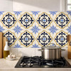 Mexican ornate blue and white floral Talavera relief tile used as kitchen backsplash, bold sculpted detail adding artisanal depth