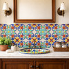 Handcrafted talavera acanthus floral relief tile featured on bathroom vanity accent wall