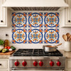Talavera circular fleur cross relief tile used as a kitchen backsplash with bold relief and solid color design