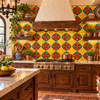 Mexican relief tile red green quatrefoil bringing bold artisan color to a Spanish kitchen